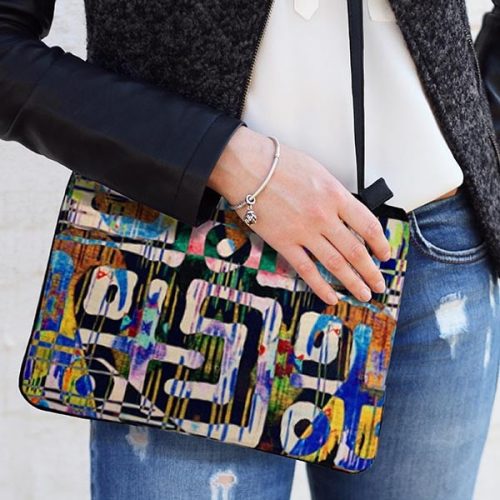 model holding Traveler Tribal Jones Crossbody bag 600x600 V1